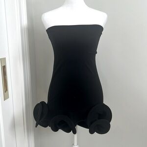 Black stretchy MAISON dress with detail on the bottom